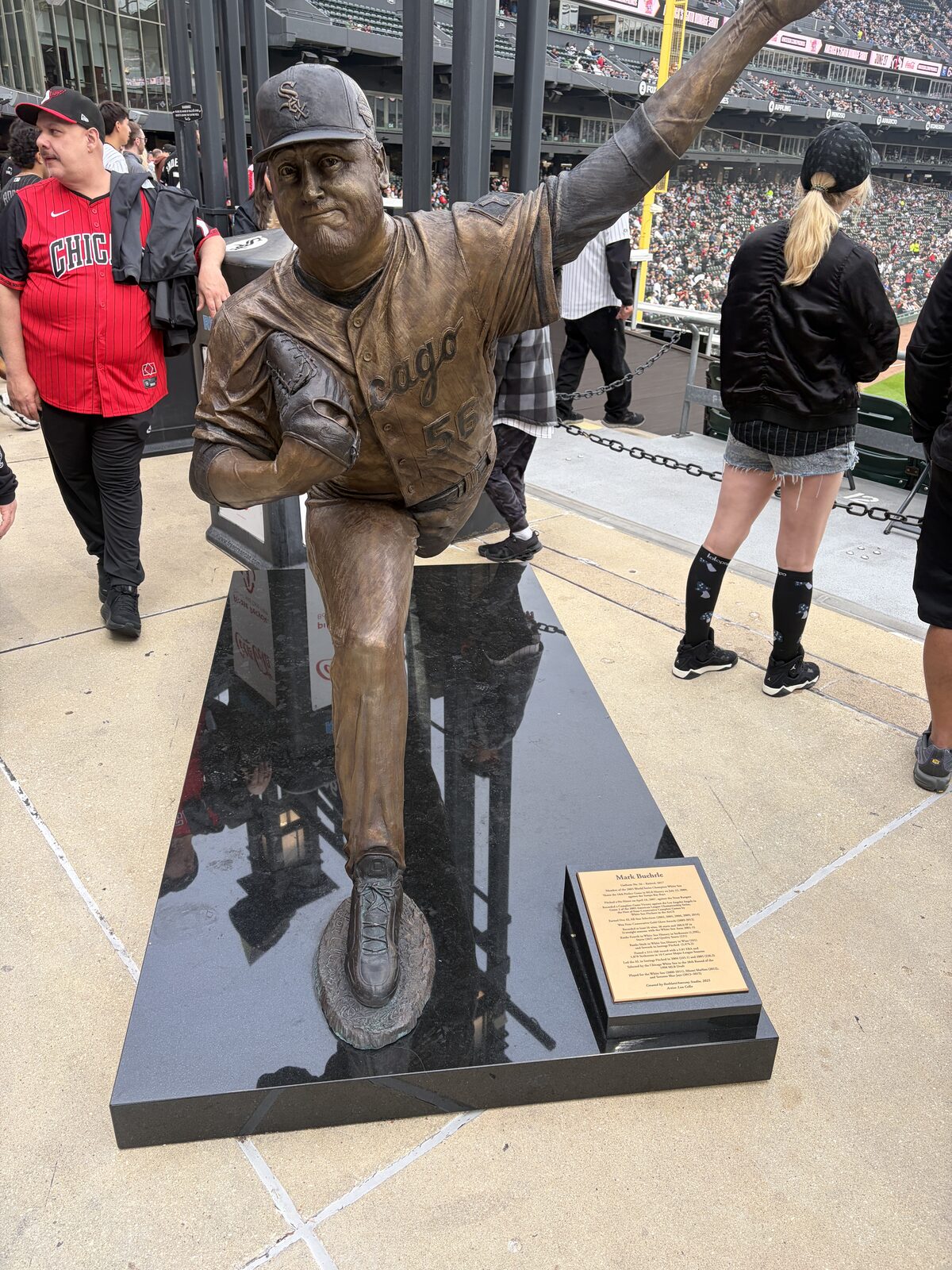 Legends cast in bronze outside the park — the company Ozzie's No. 13 now keeps in the rafters.